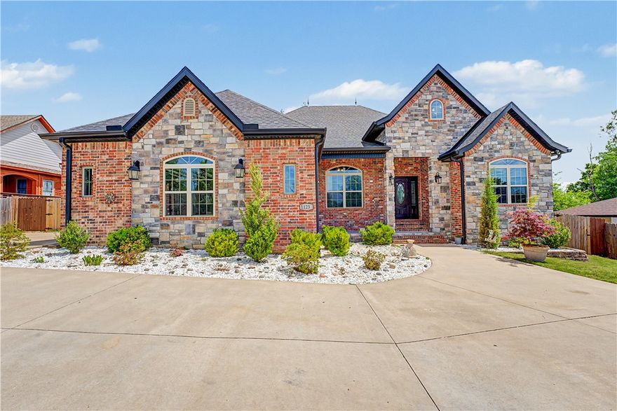 Beautiful custom-built 2020 modern home designed for comfortable family living, featuring soaring cathedral ceilings, abundant natural light, and upscale finishes throughout. The open-concept layout showcases custom cabinetry, granite countertops, a gas range, LED lighting, and smart home sensors. Enjoy relaxing front and back porches with durable epoxy flooring, plus insulated storage, a tankless water heater, and security cameras for added convenience and peace of mind. Ideally located near walking trails, shopping, schools, a church, and a hospital. A rare blend of style, comfort, and location! Refrigerator, washer, dryer, and gym equipment do not convey.