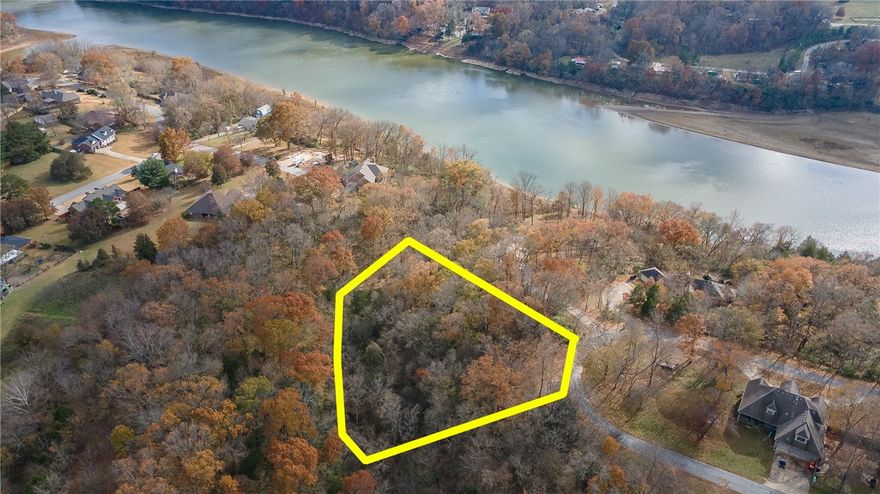 Gorgeous 1.45 acre residential building lot with views of White River/Beaver Lake!  This lot has beautiful mature trees and a quiet street that is the perfect setting for your dream home!  Water, electricity, and gas are at the street.  Property will need a septic.  Full survey is available.  Zoned for Springdale Schools.