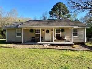 Cute, country and affordable! If you've been looking and just couldn't stomach the price, you've found the perfect place to settle down and enjoy the country life. 3 bedroom 2 bath home with eat in kitchen. The front yard is fenced and in the back is a storage building and a wooded area to explode nature!