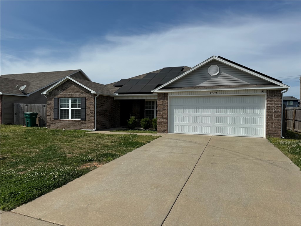 Welcome to this stunning newer construction home with a spacious yard, perfect for outdoor gatherings and play. As you enter, you're greeted by an open living room and kitchen layout, ideal for entertaining guests or keeping an eye on the family. This home offers four bedrooms, providing ample space for a growing family or accommodating guests. The two bathrooms are elegantly designed, with modern fixtures and finishes. Equipped with solar panels making it energy efficient.