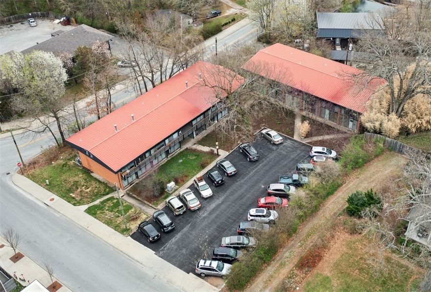 Extraordinary investment opportunity a block away from the University of Arkansas! The location of these fourteen mid-century modern units with an industrial retro flare can’t be beat . Complex recently improved with multiple units updated. With fourteen units between two buildings there are eight single story units, and six two story units. Don’t miss this one of kind investment opportunity!