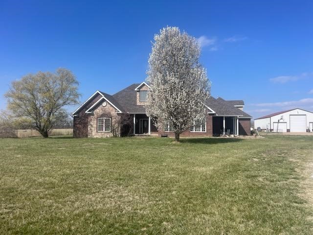 Beautiful 4 bedroom, 3 bath, 3500 square-foot home with an oversized and heated two car garage and a large insulated 40 x 60 shop that is also heated, and has a 3/4 bath and includes full hook up for RV inside the shop that is all sitting on 16.65 acres. Located just off paved Road. Rural water, 3 central A/C units, roof less than three years old, wonderful kitchen with cabinets galore, unique metal countertops, Center Island, gas log fireplace in the spacious living/family room, gorgeous crown, molding, and trim throughout, large bedrooms & closets. There is a safe room/storm shelter located in one of the primary closets. Property is fenced for animals and has a nice pond. This property is in a great location in NW Arkansas only minutes away from the XNA Airport, and only a short driving distance to Bentonville, Springdale, Fayetteville or Downtown Siloam Springs.