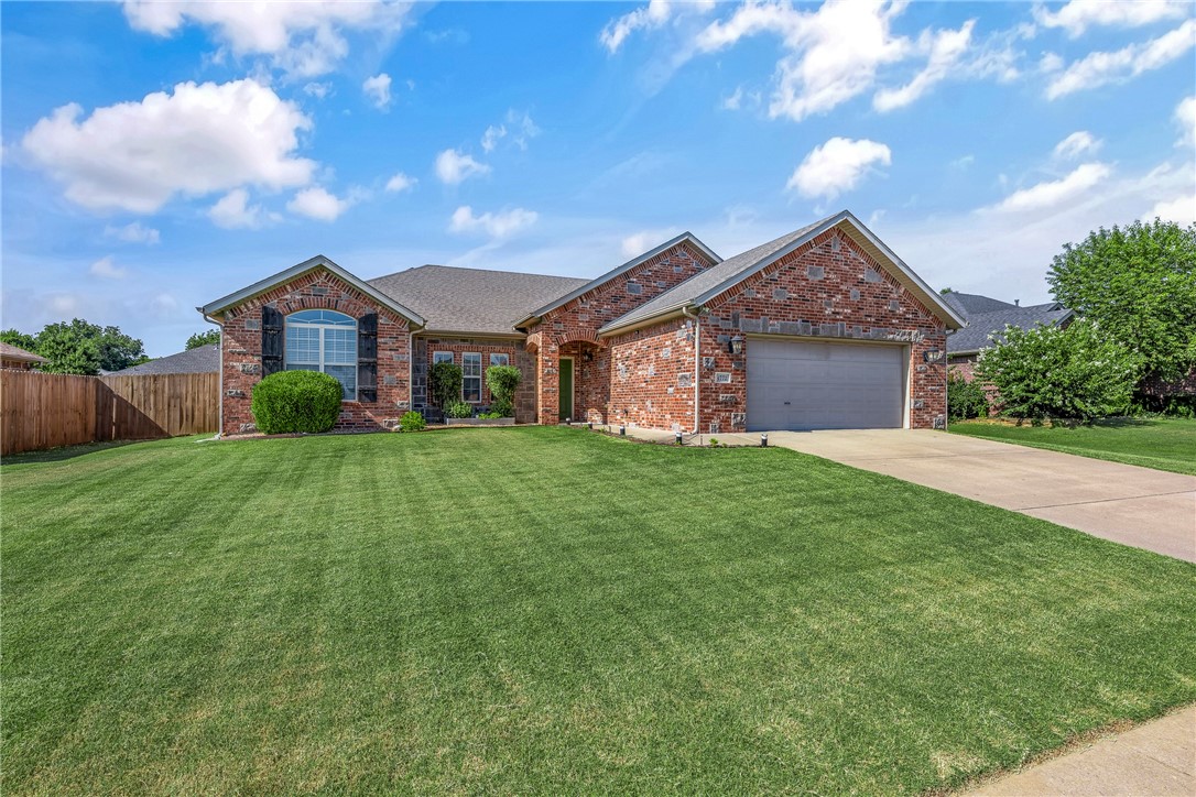 This beautiful home offers high ceilings, crown molding, and a spacious open/split layout. The kitchen opens to the living room and features granite counters, with ample storage. The formal dining room, currently used as an office/study, is framed by two sets of glass white French doors.The master suite includes a trey ceiling, jetted tub, walk-in shower, dual vanities, and two closets. Enjoy a privacy-fenced backyard with room to entertain, garden, or play. Washer, dryer, Murphy bed, folding gym equipment with weights in garage, and garage storage racks all staying with the home.