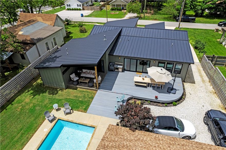 Walking distance to the Downtown Bentonville Square! Completely renovated contemporary house...new HVAC, roof, hot water heater, flooring, paint, appliances, and MORE! Enjoy entertaining poolside and then take a stroll to The Momentary which is just 2 blocks away! 2 primary bedrooms with en-suite bathrooms. The office could be also be utilized as a bedroom or bonus room. The backyard is an oasis with a custom 10 foot modern privacy fence. Property is currently used as a weekend Airbnb and currently rents for $490 per night as only 3 bedrooms are used.