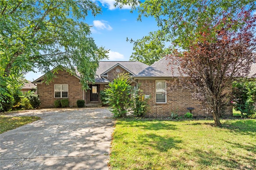 Welcome to one of the most desirable areas in all of NW Arkansas! This charming 3-bed, 2-bath home is nestled in the heart of Bentonville and features a spacious open-concept living area with a cozy fireplace, perfect for relaxation after a busy day. The well-appointed kitchen boasts stainless steel appliances, and a convenient breakfast bar. The large master bedroom includes an attached bathroom with a relaxing jetted tub and dual vanities. The serene backyard’s beautifully-maintained lawn and spacious deck is ideal for outdoor gatherings with friends and family. Located just minutes from WMT headquarters, Applegate Trailhead and Coler Creek, this home is also minutes from the 8th Street Gateway Park – the new center for community recreation and urban nature! This new park is positioned as the civic and cultural centerpiece of Bentonville’s western growth and this home is located in the heart of all that makes this area one of the most desirable in NW Arkansas! Stop by soon to see this one-of-a-kind property!