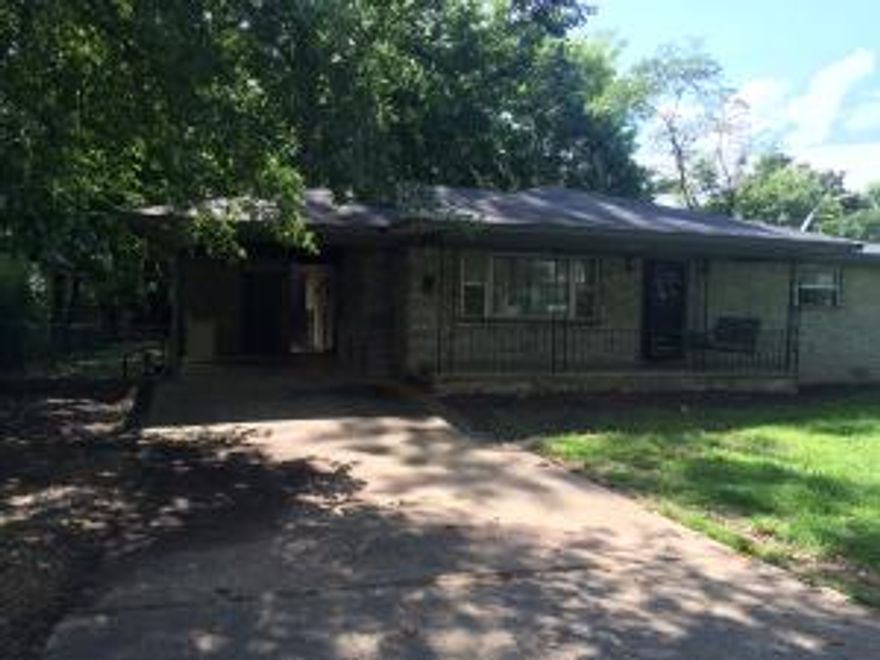 SPACIOUS 4 BEDROOM/2 BATH ON AN EXTRA LARGE LOT WITH A FENCED BACKYARD, STORAGE BUILDING, CARPORT, & COVERED PATIO. KITCHEN INCLUDES REFRIGERATOR AND NEW STOVE.