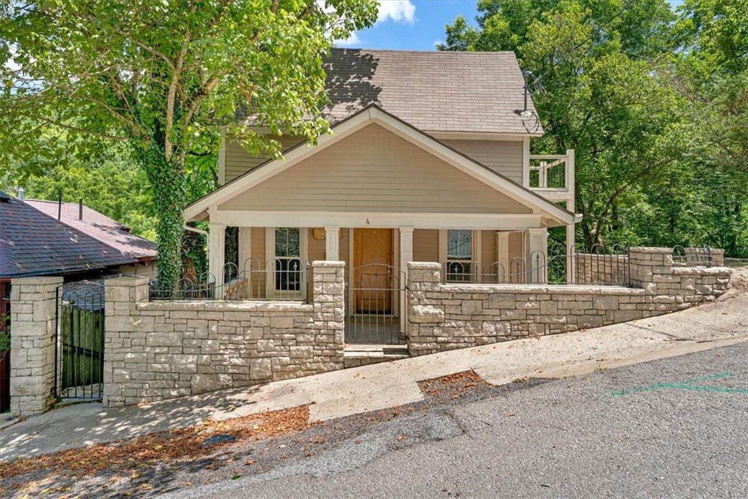 Built in 1892, this historic cottage has been thoughtfully reimagined-blending Eureka history with modern flexibility, character & INCOME POTENTIAL! All just steps from Eureka Springsā vibrant downtown. Surrounded by beautifully crafted stonework and terraced outdoor spaces, the home is divided into three unique units: a stylish 2BD/2BA main residence featuring tin ceilings, a fireplace & architectural flair, plus two separate studio apartments, each with private entrances. With a strong track record as a long-term rental, this character-filled property invites endless possibilities: host visiting friends or family, create an inspiring studio or retreat space, or expand your rental portfolio. Outdoors, youāll LOVE the inspiring landscape and hillside views, all within walking distance to the lively, artsy & delicious downtown. And with 3 designated off-street parking spotsāthis hidden gem delivers adaptability, income potential, and location in one unforgettable package. Let 4 Douglas adapt to YOUR vision!