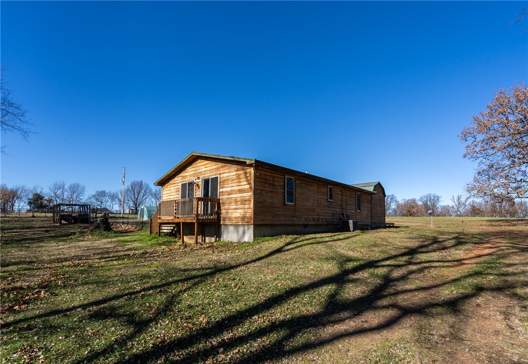 Country Living with Convenience! Just 25 minutes from either Bentonville or Siloam Springs, this charming hobby farm offers nearly 24 acres of open pasture and woods—partially fenced and currently used for horses. Ideal for livestock, hunting, or simply enjoying the peaceful setting with abundant wildlife just outside your windows. The property includes a 2-bedroom, 2.5-bath home that could serve as your primary residence, weekend retreat, or a rental while you build your dream home. Additional improvements include a screened-in tea house, a storage building, and two horse sheds. AC new in 2025 Endless possibilities await—whether you're looking for a private getaway, a small farm, or an investment opportunity. Sellers are very motivated, so bring an offer today! Owners are very flexible in what they will sell. Agent-owned. Owners will also consider selling home w/5 acres. Also available: 100 acres listed under MLS #1315040, 1316069 23 acres,(approx) 1318229 15 acres (approximately). Also listed in Res MLS 1315401