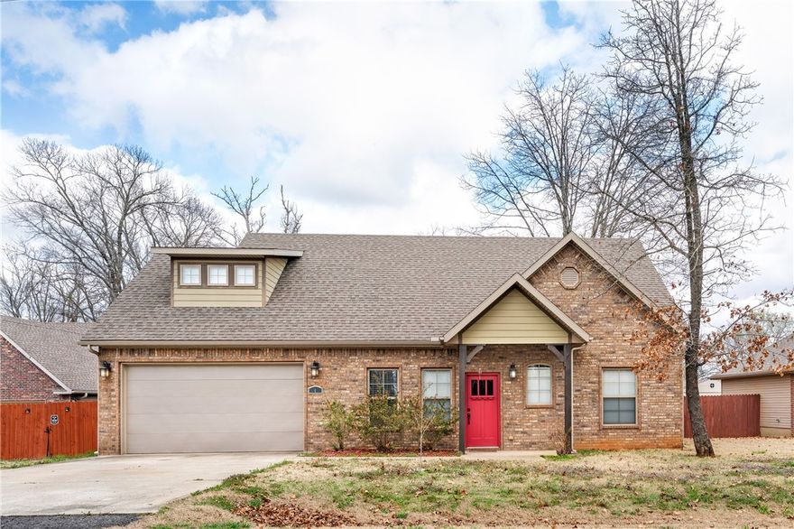 Welcoming Bella Vista home offering a layout that blends comfort, functionality and flexible living space. The main level features a warm and inviting living area with a fireplace that opens into a kitchen with abundant cabinet space, generous storage and an eat-in island, creating a natural flow between the living and kitchen areas that makes the space ideal for everyday living and casual gatherings. A primary bedroom is conveniently located on the main level and includes a private bath with jetted tub, dual sinks, walk-in shower and a spacious walk-in closet. Upstairs includes two additional bedrooms with a second living area that can easily serve as a media room, playroom, or lounge space along with a versatile flex area ideal for a home office, reading nook or creative workspace. Step outside to a comfortable backyard space perfect for relaxing or spending time with family and friends. Enjoy an unbeatable location near beautiful lakes, golf courses, parks and miles of scenic biking and walking trails.