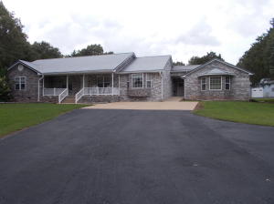 Get-A-Way at home! This large, private, well built, home on 5 park like acres, is very well kept and has many amenities including; large concrete block shop, paved driveway, above ground pool, sunroom, huge family room, deck, jetted tub, hardwood floors, spacious kitchen, and is handicapped accessible. Located only 20 minutes from town!