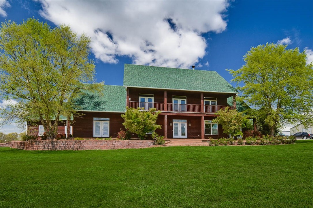 Spectacular farm located in Hindsville accessed with remote controlled gated entry! Beautiful rolling 56.4 acres w/ incredible views from all angles which includes 20 wooded acres…perfect for hunters! 3 beds with one as a mother-in-law suite or perfect for an older teen, w/ separate laundry room & garage entrance. Master suite is a must see along w/ the massive deck off the master bath that overlooks the land & pool. Picture yourself in the oversize kitchen complete w/granite & cement counters, large windows that overlook the pool, large walk-in pantry, 2 eat-in dining areas, & 2nd laundry room! Lighted horse-riding arena setup for team roping. Gunite, chlorine pool w/cooling deck! Home is wired for generator hookup. Too many items to list, see attached list for more perks! Vacant white house at entrance of property is included as-is. Mother-in-Law washer + dryer convey. Wood stove in upstairs master bedroom & large rocks in front & backyard do not convey. Pre-qual letter/proof of funds required prior to showings.