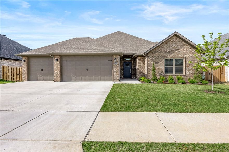 Built in 2024 and perfectly located. This all-brick home offers lasting quality with gutters, a fully fenced yard, and a spacious 3-car garage. Inside, the open floor plan is filled with natural light from large windows and showcases 3 generous bedrooms and 2.5 bathrooms with high-end finishes throughout. The heart of the home is the stunning kitchen—featuring custom cabinetry, granite countertops, stainless steel appliances, and a gas cooktop—perfect for cooking and entertaining. The luxurious primary suite offers a true retreat, with two walk-in closets, a beautifully tiled shower, and a relaxing soaking tub. Step outside to a covered patio and enjoy peaceful outdoor living.  Centrally located near top-rated schools and the new home office campus, all while maintaining a serene country feel.