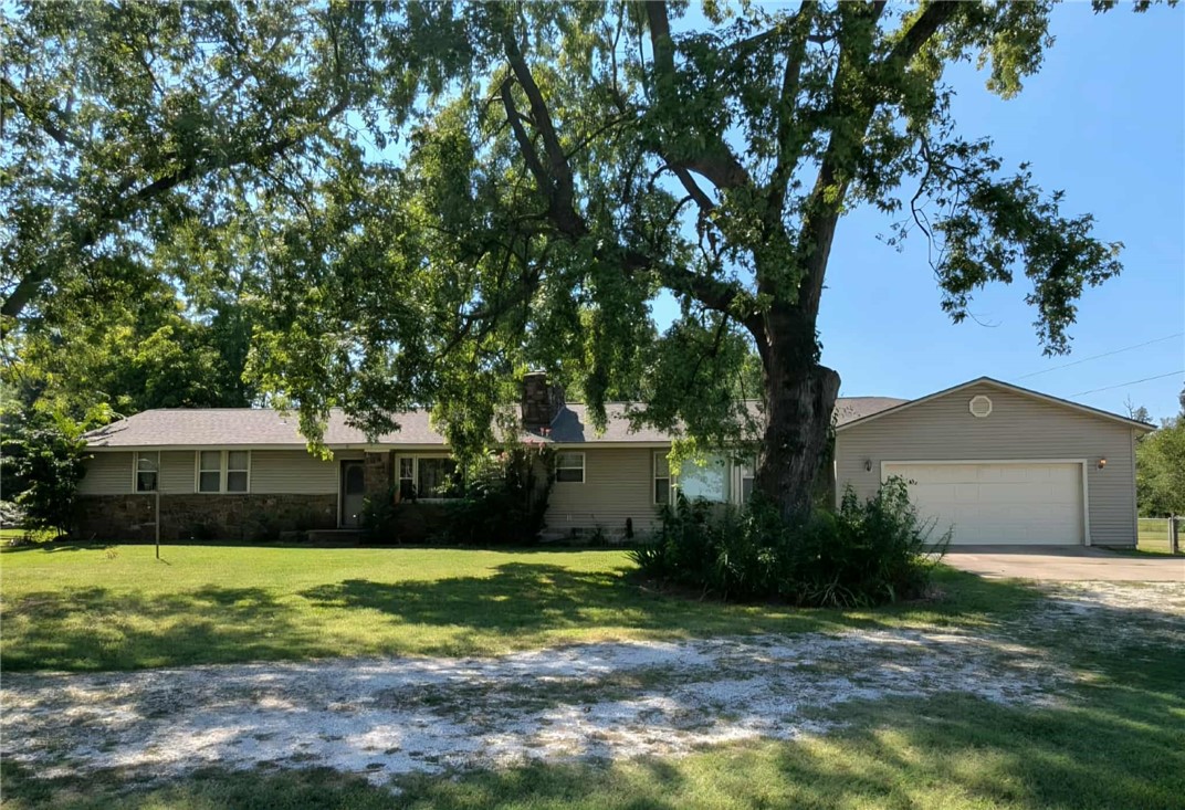 Located at the edge of Prairie Grove right on Hwy 62, 3 minutes from Farmington, 5 miles from I-49. This is a must see home, 3 BD, 3 BA, covered back porch, 2900 sq. ft home on 1.86 acres. Property is zoned as agricultural and can be used for a commercial property as well.