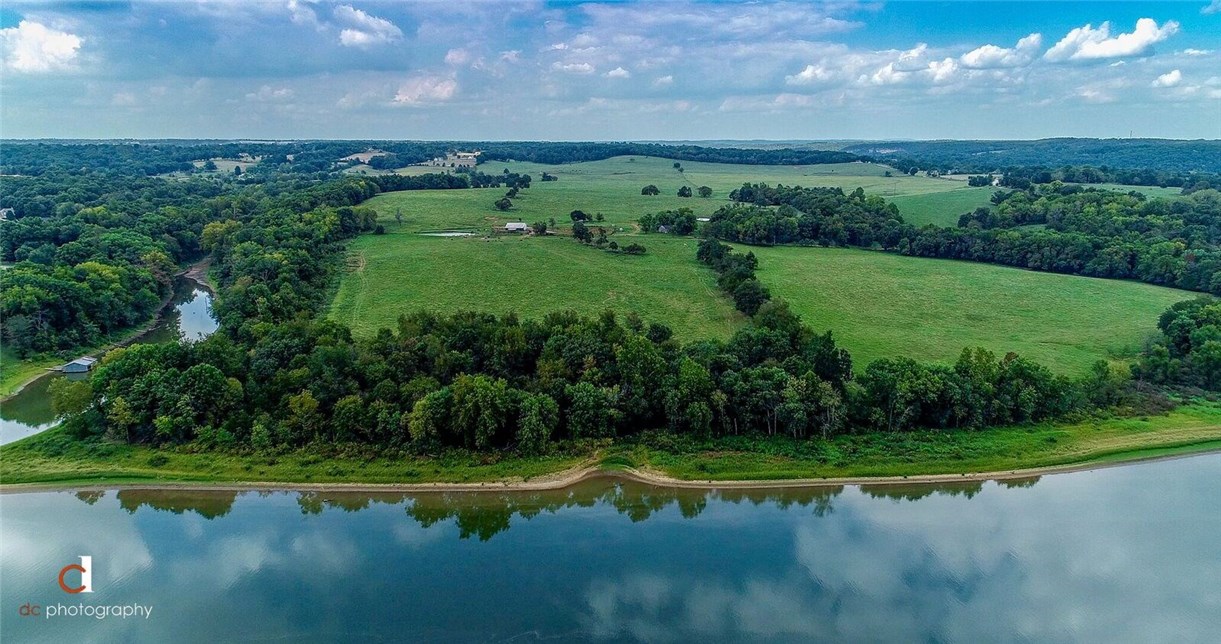 One of the most beautiful acreages you will ever see! Watch the aerial drone video under the virtual tours link! 1800' frontage x 6700' depth approx. 3800' lake frontage. Gently rolling & flat acreage. Land goes all the way to Beaver Lake. Ideal for building home with acreage or for a builder's subdivision. 1 mile to Public Boat Ramp. Would be Ideal for Golf Course also! Listing is for both "B" and "C" parcels on aerial map in photos. Option to subdivide, please reference MLS #1078493 & MLS #1078500