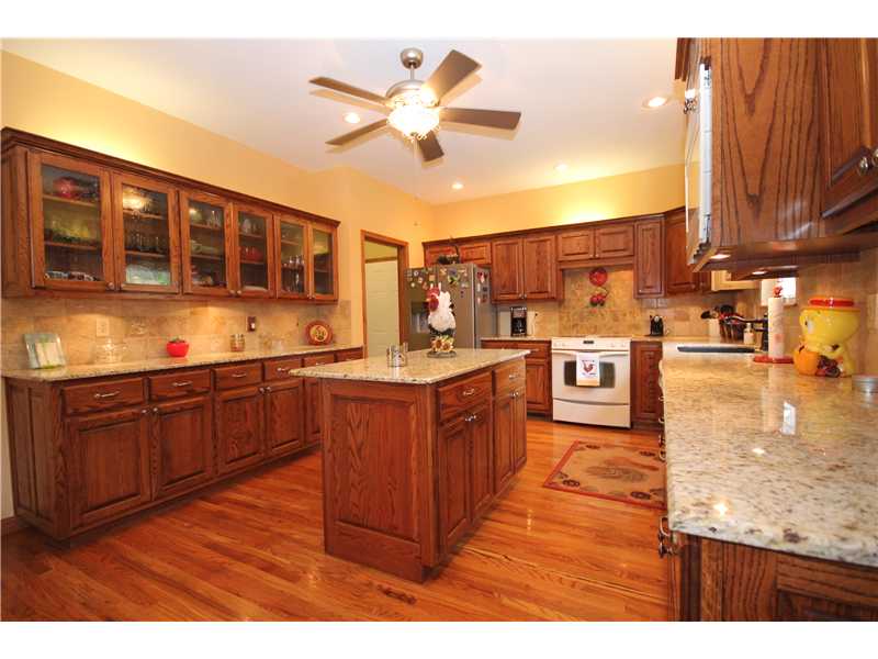 Wonderful home! Real wood floors throughout the house, no carpet! Solid wood doors. Stunning Kitchen with granite counter tops and a movable island. 3 car garage. Geo thermal heat. Pellet stove insert. Beautifully landscaped. Large deck. One level!