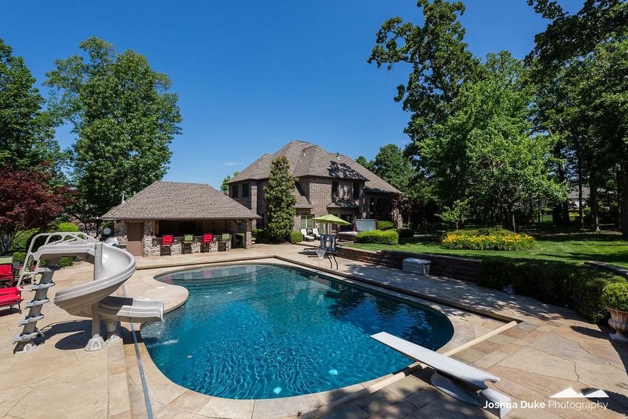 YOUR DREAM VACATION IN YOUR OWN BACKYARD! Remarkable one owner property is an entertainer's delight! Located in the exclusive Clear Creek Golf Community/Blessings Golf Course. Great floor plan with 4 bedrooms, 2 Jack and Jill baths, formal dining, formal living room, office, den, bonus room with kitchenette, 2 fireplaces, new paint throughout, and cherry hardwood floors! Wonderful amenities galore! Park-like oasis back yard with stunning waterfall, hot tub, and wonderful pool with slide. Lovely Cabana features granite countertops, bar area with refrigerator, ice maker, sink, surround sound, grill, fireplace for casual dining and a full bath. Located in a quiet cul-de-sac, don't miss seeing this EXQUISITE property!