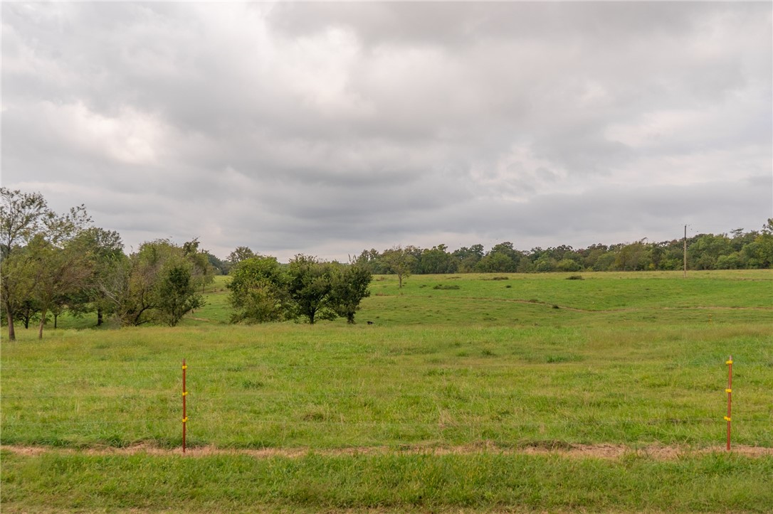 Acreage near XNA provides endless potential! Level land in fast-growing area is perfect for residential development, small farm or cattle operation, or commercial use. This prime location plus open possibilities equals a smart investment, offering a blank canvas to your vision, whether you want to farm, develop or invest in the future. Coming soon is Hwy 612 which exits at the XNA entrance making this property easily accessible to all of NWA.