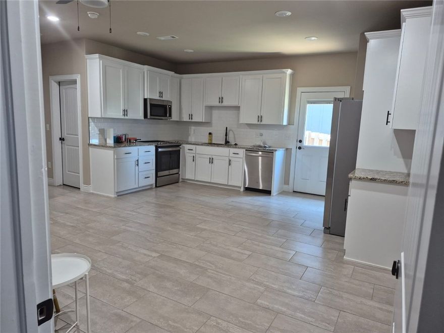 2616 N Justin Dr, Fayetteville, AR-72704 unit-A - A modern 1 bedroom, 1 bathroom townhome unit featuring a generously sized kitchen, complete with dishwasher, fridge, stove, and washer/dryer set! Easily move in. Located only approximately 3 miles from the University of Arkansas, a short drive to shopping locales, and easy access to I-49. This unit offers convenience, comfort, and an easy move-in experience. Ideal for anyone looking for a low-maintenance Fayetteville renting experience.

Property Features
Ideal Fayetteville Location
Included appliances: Fridge, stove, dishwasher, and washer/dryer SET!
Modern design,
Easy access to shopping, U of A, and I-49

Fee Disclosure
In addition to rent, the following fees apply:
$300 monthly utility charge. Includes all utilities except internet.
Monthly Pet Fees apply (if applicable): $60 per pet per month. $250 pet deposit required with a pet. Breed restrictions apply.