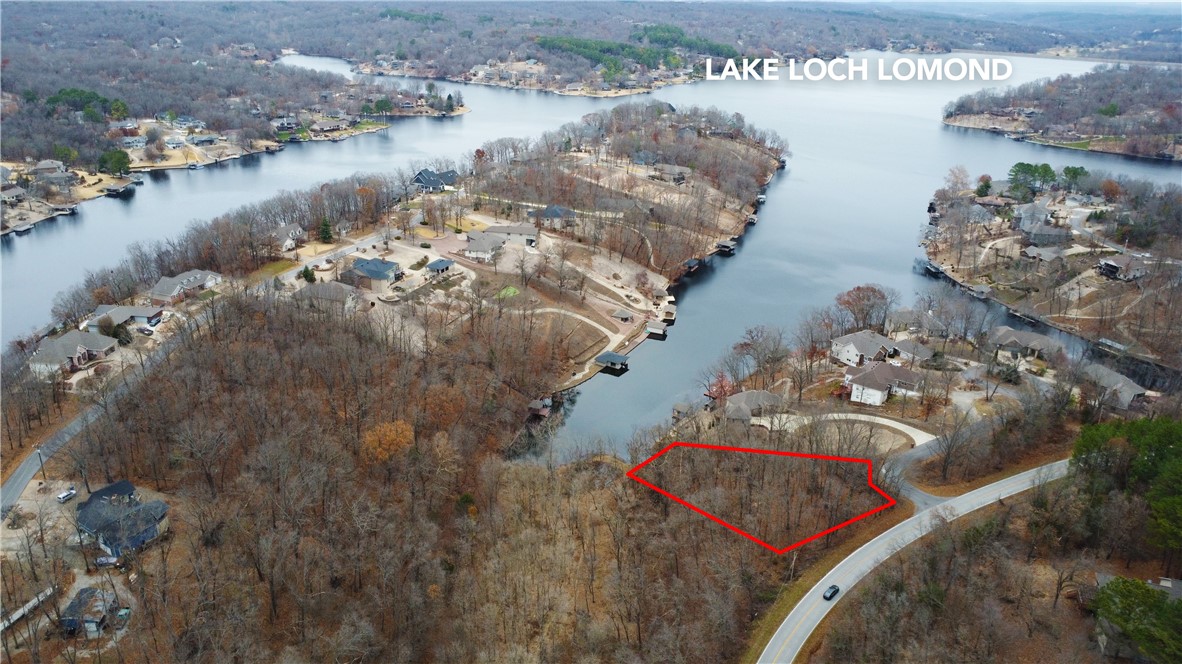 Hard to find lake front lot on Loch Lomond that is located within close proximity
to both Tiree Park and Granton Park. Lot is .66 acres that provides direct access to the lake, while adjoining Bella Vista common property to the west. Conveniently located with a short drive back to I-49 to access everything NWA has to offer.