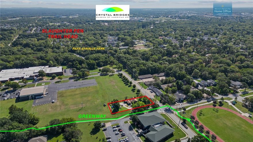.47 lot with major development potential situated in close proximity/walkable distance to four schools, adjacent to paved Razorback Greenway biking/walking trails, a short ride/walk to Park Springs Park & mountain biking trails at the intersection of N.W. A Street & Tiger Blvd, & a 5 minute drive to Crystal Bridges Museum of American Art, The Amazeum, & Downtown Bentonville. Lot is zoned R-3,
Medium-High Density Multi-Family Residential. Recent survey available. Value is in land only.  Shed and chain link fence do not convey.