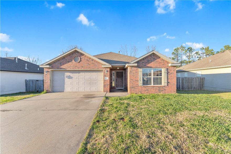 Charming and well-maintained 3-bedroom, 2-bath home in a desirable Rogers location! This home features an inviting open layout with high ceilings and elegant crown molding, creating a bright and spacious feel throughout the main living areas.

The kitchen is equipped with granite countertops, ample cabinet space, a pantry, and a comfortable eat-in dining area—perfect for everyday living. Durable wood-look tile flooring flows through the entry, living room, and hallway, adding both style and easy maintenance.

Relax in the cozy living room with a fireplace, or unwind in the spacious primary suite featuring a double vanity and plenty of room to spread out. Step outside to enjoy a large, flat backyard with a privacy fence—ideal for entertaining, pets, or play.