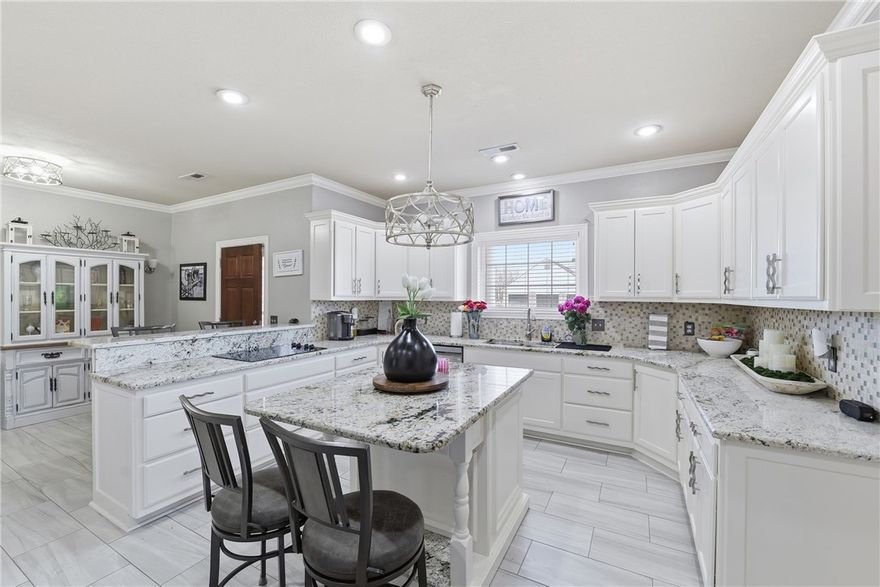 Beautifully updated home on nearly an acre in Lowell, just west of I-49! Motivated seller ready to make a deal.

Step inside to find granite countertops, fresh paint, and a newer roof (2019), along with hardwood and tile flooring throughout much of the main level.

The layout offers three bedrooms and three full baths downstairs, plus multiple living and dining areas that make it easy to spread out or entertain.

Upstairs, a private suite with a full bath works perfectly for guests, a home office, or whatever fits your lifestyle.

Outside, enjoy a covered patio overlooking the spacious yard and a 30×30 workshop—ideal for projects, storage, or extra parking.