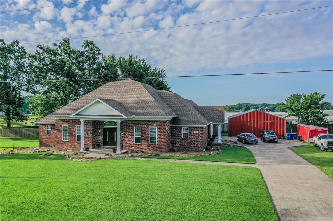 Beautifully updated two-story home on nearly an acre in Lowell! This 4-bed, 4-bath home offers fresh paint, granite countertops, a newer roof (2019), and a spacious layout perfect for entertaining. Main level features 3 beds, 3 full baths, hardwood/tile floors, and multiple living/dining areas. Upstairs, enjoy a private suite with its own full bath ā ideal for guests or a home office. Step outside to a covered patio and a massive 30Ć30 workshop for hobbies, storage, or extra parking. Located in a quiet cul-de-sac with space and privacy just minutes from Bentonville, Rogers, and Fayetteville!