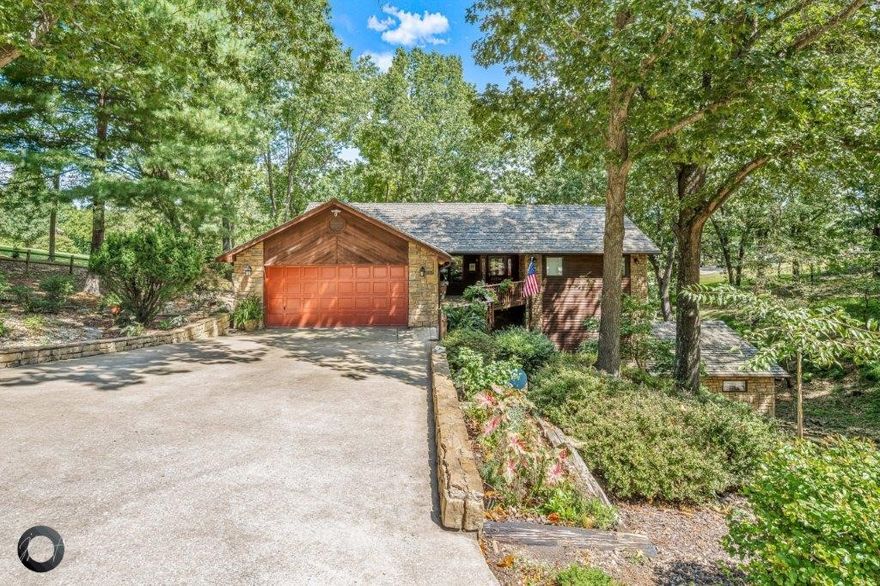 Totally remodeled in 2017! Lake front with easy walk to water and dock. 1 14'x25' slip w/lift conveys. Dock has swim deck and fish cleaning station. Stunning interior finishes including variable plank solid wood floors, custom cabinetry, heated main bath floors, floor to ceiling stacked stone fireplace, GE profile appliances w/double ovens and two levels of covered trex decking. 6 car garage attached to home and extensive landscaping all around!