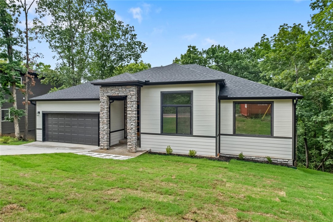 Are you looking for your DREAM HOME? Look no further! This beautiful new construction home in the heart of Bella Vista is just what you need. This home backs up to the Tunnel Vision Bike Trail. Jump on your bike and hit the trails from your backyard! Located in the Bentonville School District and a short drive from the Walmart Home Office. This home includes 10 foot ceilings, custom cabinets, tile in all bathrooms and black vinyl windows. Home is equipped for smart home technology!