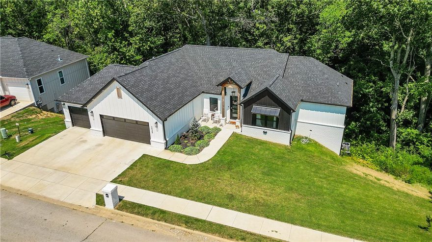 Want to live on the golf course? Here’s your chance! This beautiful two-story home in Big Sugar Golf Course is near the clubhouse, driving range, and Big Sugar gravel trail. Just minutes from downtown Rogers and Bentonville as well as Bella Vista’s trail system. The primary and guest bedrooms are upstairs, while additional bedrooms sit in a spacious walkout basement with its own living area. A partially unfinished section—already counted in the square footage—could serve as a media room, gym, office or more. Only a couple years old, the home features updated systems, a solid roof, granite countertops, and luxury vinyl plank flooring throughout. Enjoy entertaining in the open floor plan, outdoor living on double decks, and ample storage in the three-car garage. So much to see.  Book your private showing today!