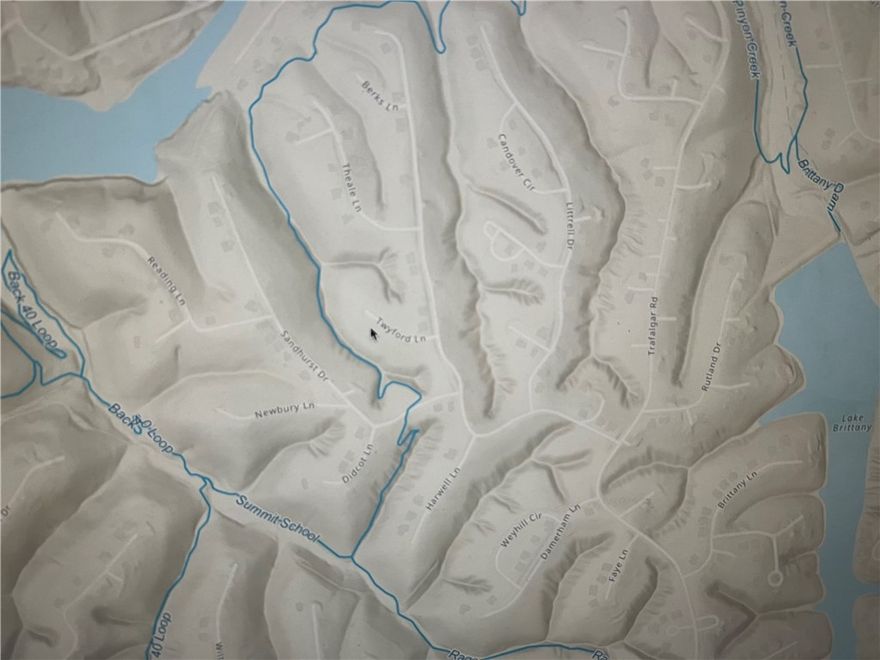 Bike in and out onto Summit School from your own backyard! Buildable, Perced, Surveyed and Septic Designed lot on the Summit School Trail surrounded by Lake Ann, Lake Brittany and the Back 40 Loop! Buckingham/Back 40 Loop Trailhead less than 1.5 miles aways! Beautifully Developed street with New Construction (less than 12 months) in established and coveted neighborhood. Perfect location for enjoying the Ozarks in the Mountain Bike Capital of the World! Trail access from back of lot is easily achieved, making this lot a true Bike In/Bike Out! Countless exciting features coming to the Mountain Bike Trails of Bella Vista, making it the Crown Jewel of Resort & Recreation Living in NWA. Get a head start on your dream home or income-generating STR with this exciting lot!