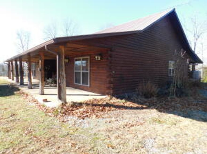 This 1723 sq ft, 3 bedroom, 2 bath Cedar home on 198 acres m/l is located in the heart of the Ozarks with a portion of the south boundary with Dogpatch and Johnny Morris' planned Marble Falls Nature Park development in Newton County. Features of this custom built home include ceramic tile throughout, wood burning stove with creek rock hearth (in addition to central HVAC), vaulted living room ceiling, cover front and back porches running entire length of home, 2 car garage and jacuzzi tub in master bathroom. Outside features include storm cellar with deck on top, green house and garden shed workshop area. Land features many additional buildings sites with great views. Perfect for development with older road beds established along the benches.