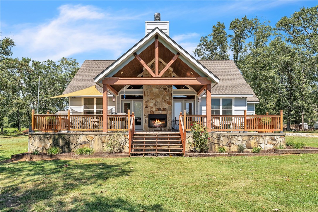 The perfect country retreat on 2 acres can now be yours. Built in 2018, this open-concept one-level beauty immediately draws you in with the natural light, tongue & groove wood cathedral ceiling, and stone fireplace. The modern kitchen offers a large L-shaped island, open shelving, and lots of prep and storage space. Next, step out onto your huge covered patio and relax next to the outdoor fireplace with your favorite beverage or soak up some sun in the uncovered area. The spacious primary suite will wow you with its modern 2-sink vanity, jetted soaking tub, separate shower, and walk-in closet with custom shelves & drawers. A large laundry room with shelving & counterspace along with the durable tile floors throughout round off the impeccable interior features of this home. The outside is just as great with a 25x41 insulated shop with electricity, water, and a separate bathroom. The 12x16 storage shed has electricity and is finished perfectly for an office space or hobby room. 30 amp RV hookup and cleanout at shop.