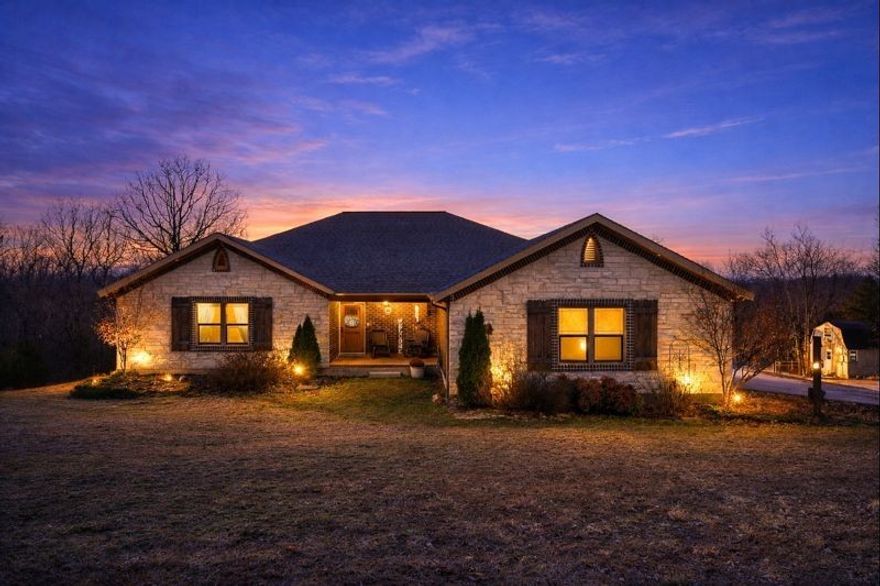 Set on 5 private acres, this Huntsville retreat blends refined comfort with exceptional versatility. The main level offers three bedrooms and 2.5 baths, featuring an open, welcoming layout ideal for both everyday living and elevated entertaining. Step onto the expansive back deck, an absolute showstopper, where peaceful wooded views create a true sense of escape. The finished walk-out basement adds exceptional flexibility with two additional bedrooms, a full bath, storm shelter, and a spacious open area perfect for gathering, hobbies, or extended stays. A detached ADU provides even more opportunity for multi-generational living, guest quarters, or income potential. The private detached living suite has a kitchen and loft bedroom. This property was thoughtfully designed and surrounded by nature, it delivers privacy, luxury, and lifestyle, just minutes from town yet worlds away. Google Maps is not accurate for location. $3,500 preferred lender credit.