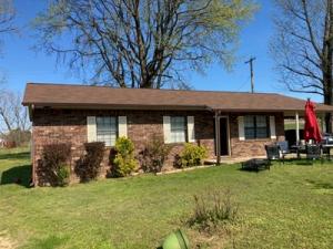 This one will not last long at this price. NEW roof installed in 2020. The home has new laminate floor coverings except in the master bedroom. Brick and vinyl exterior for easy maintenance. CH/A, all electric, and end of street location. New kitchen exterior door, mini-blinds and range included. Owner on paint now.
