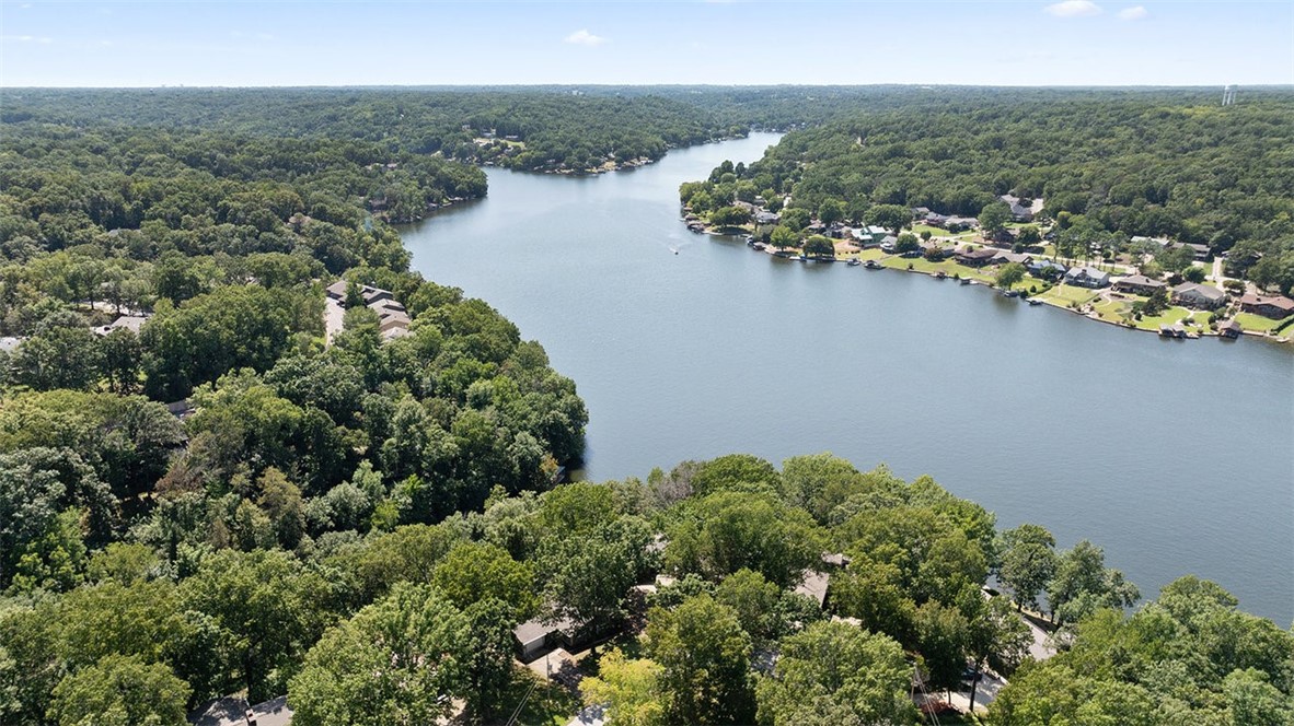 This inviting two story, 3 bedroom, 2 bath home offers comfort, charm, and stunning lake views with direct water access. The main level features a cozy living area anchored by a fireplace and windows that bring the outdoors in. Step out onto the deck to enjoy peaceful mornings, wonderful sunsets, and the sights and sounds of natural beauty. A private dock awaits for boating, fishing, or swimming, with a convenient tram that carries you directly to the dock so lake days are easy for all ages. Downstairs flex room can be another bedroom or a bonus room with a private bath and lake view. This property lets you enjoy Bella Vistaās unique lifestyleāworld-class golf, hiking and biking trails, parks, and the natural beauty of the Ozark's. See
Approved borrowers will receive a closing cost credit of 1% of the loan amount up to $5,000 on their Closing Disclosure on their loan closing with Envoy Mortgage Branch NMLS #2659248 and Branch NMLS #2579798.