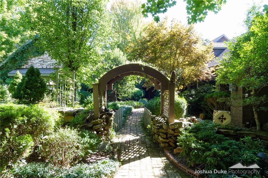 Looking for Narnia?  This is it!!!  I've been in the business for 33 years and have never seen a property like this.  A piece of heaven within 15 minutes of Fayetteville containing 37 acres with approximately 18-20 cleared and bordered by magnificent trees.  And 17 acres of woods with some of the most beautiful trees and woods you will ever see. Gorgeous 1 acre pond with private fishing deck.  This cottage in the woods has been lovingly cared for.  The landscape is like a botanical garden.  Several outbuildings: a log barn, 4 stall horse barn with concrete floors and a hay barn.