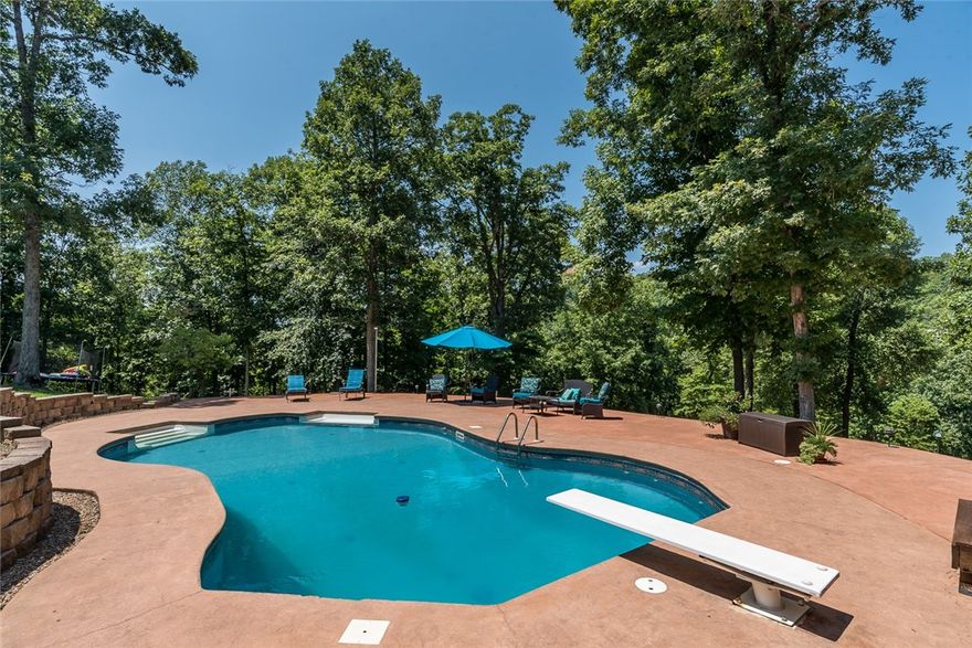 Gorgeous Beaver Lake Estate Home! Over 26 acres with a horse stable, in-ground pool, private solar powered boat dock w/2 boat slips w/lifts & more! Enjoy privacy and surrounding wildlife plus all the perks of lakefront living! Enjoy relaxing by the pool on the patio or covered pool house deck after a day on the lake. Multiple outdoor living spaces. Spacious interior with large windows for views and natural light. The spacious living room has vaulted ceilings, built-ins, and fireplace. Stunning eat-in kitchen has a large island, granite tops, built-in stainless appliances & much more! The master suite is a true retreat with a private sunroom and spa-like bath w/steam shower. Finished basement provides an additional living area with fireplace as well as space for game and media room. Plenty of space for entertaining in this home! Detached barn with horse stables and tack room.Gated asphalt drive from gate to dock.All new paint. This home is a MUST SEE!