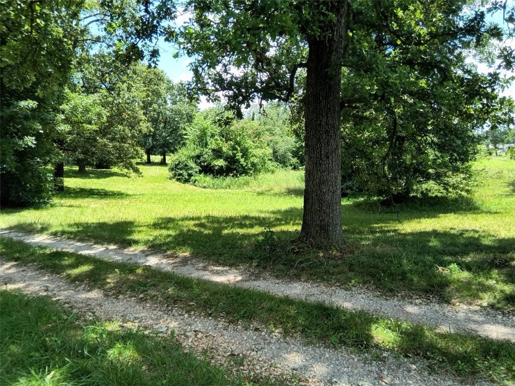 Property to be sold "AS-IS". Mobile home conveys with purchase of land and features 2 bed / 2 bath with an additional room currently serving as a bedroom. Monthly income is $750.
This scenic property would be perfect to build your dream home and has development potential. Future plans are to create an interchange for the 612 bypass at the end of the road. Convenient location to everything. Buyer should verify utilities.