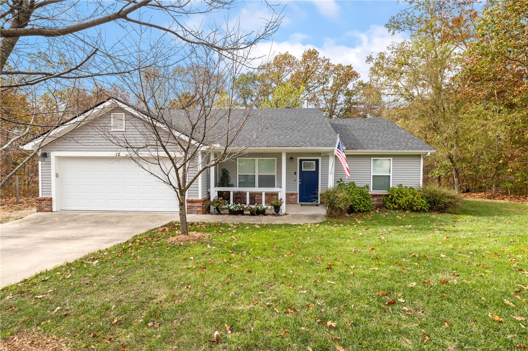 A charming 3-bedroom, 2-bath home on a relatively flat and private Bella Vista lot. The open living room boasts ample natural light, and features a beautiful wood stove, creating a cozy and inviting space. The eat-in kitchen opens directly to a spacious deck, offering seamless indoor-outdoor living perfect for entertaining or quiet evenings. A split floor plan ensures practicality and privacy, complete with deck access from the primary suite as well. The backyard boasts a large deck, a fenced garden area, and a well-maintained fescue lawn. For hobbyists, the 12x16 fully insulated shop is equipped with electric and cable hookups, plus an overhead door for carts or small vehicles. Additionally, an easement on one side of the property and wooded common property behind the home enhances privacy. Enjoy all this home has to offer along with being located in close proximity to Highlands golf course, lake Loch Lomond, and the Branchwood Rec Center.