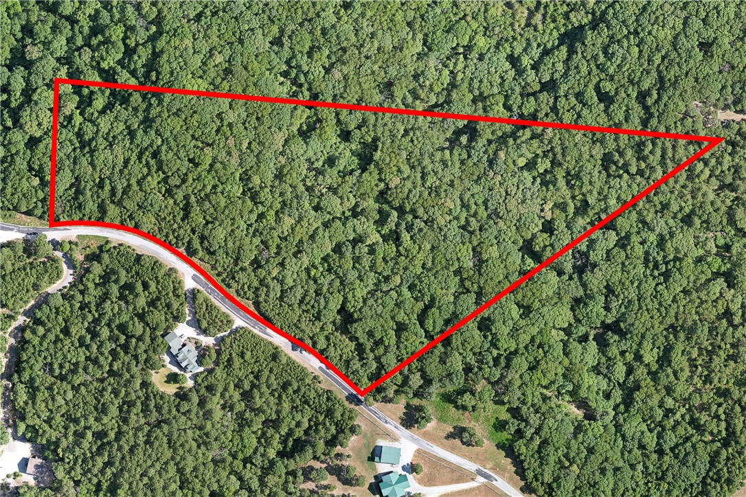 Unleash your imagination on this 15.48-acre plot of land located on CR 266 in the enchanting Eureka Springs. This versatile property offers a perfect expanse of mature trees, providing a scenic backdrop for any development. Whether you're envisioning a luxurious estate or a weekend retreat, this land provides the space and flexibility to make your dreams a reality. The peaceful surroundings, breathtaking views, and proximity to Eureka Springs' eclectic attractions and natural wonders make this an ideal location for anyone seeking a balance of solitude and adventure. Don't miss out on this unique opportunity to invest in a piece of the Ozarks' pristine landscape.
