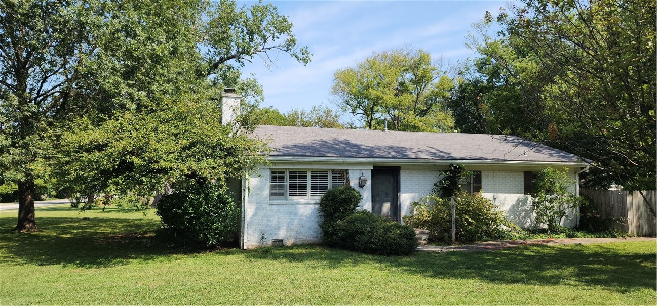 SOLD AS IS OWNER OUT OF STATE. This charming 2-bedroom, 1-bathroom all-brick home spans 1,100 square feet and features a delightful 3-season screened-in porch. Nestled on a beautiful, level 0.50-acre lot, the house was built in the 1960s. The living room boasts a gas log fireplace and plantation blinds, while the original hardwood floors extend through the living room and both bedrooms. The eat-in kitchen is fitted with vinyl flooring. The main bedroom includes a walk-in closet. Additionally, the roof is scheduled for replacement.