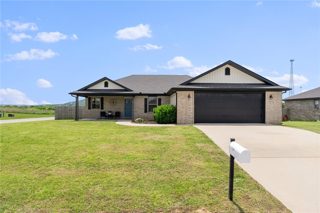 Beautiful like-new home in Hindsville sitting on a .51 acre corner lot. Enjoy peaceful country living with quick city access. This all brick home has a split floor plan with 3 bedrooms and 2 bathrooms. The kitchen features granite countertops, a stainless steel appliance package, and a breakfast nook. The home includes wood-look tile throughout the living space, tiled showers, and walk-in closets. The oversized 24' x 29' two car garage can easily accommodate a boat or other toys. NO HOA means there's endless opportunity to make this back yard your paradise. Enjoy the mountain views from your large patio. The spacious backyard is fully fenced and has RV access. This home is in a great, rural setting while only a 14 minute drive to Springdale. Don’t miss your opportunity to own this beautiful home.