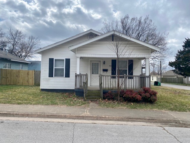 Charming home on a corner lot! Hardwood floors in living area, bedrooms, and bath. Two bedrooms have Jack and Jill bath in between. The third bedroom is off dining/kitchen area off the dining room - also this is where the washer and dryer hook ups are located. Partially fenced back yard for privacy. Oversized covered back porch! Shed located in back will be removed by owner - tenant may not use. Showings are through appointments only, please call listing agent. Applications to be completed on www.nwarealtypm.com