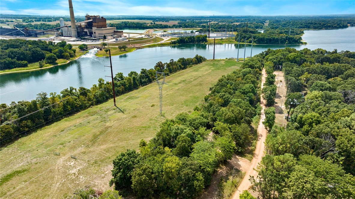 10 AC MOL - SWEPCO LAKE? WATER? FISHING? DEAD END ROAD? RV CAMPING SITE WITH UNKNOWN INCOME (please confirm approved by city/county), LOOK RIGHT HERE! This is a rare find with lots of opportunity, make your own dreams come true! The water tap is being placed, there is also a utility easement in place on the property. Come see what your dreams hold in the beautiful lake area of Gentry!