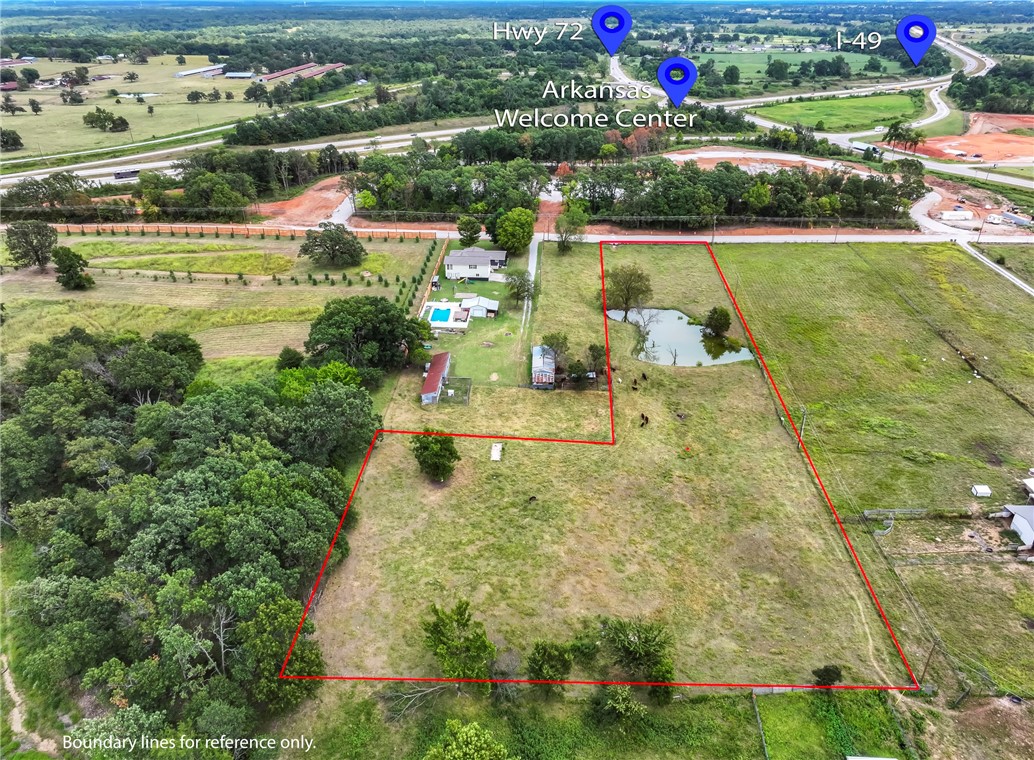 Almost 3 acres with endless opportunities. Located just off I-49 giving easy access to all Northwest Arkansas has to offer. Recently paved road and positioned across from the new Arkansas Welcome Center currently under construction.