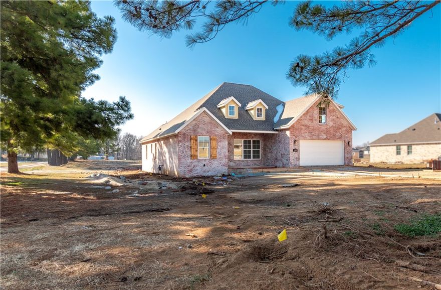 Welcome to your dream home! This stunning, brand-new, all-brick 4-bed, 3-bath home sits on a sprawling 1.62-acre lot, offering space and serenity while still being minutes from shopping, dining, parks, trails, i49, schools, and more! Home features beautiful quartz countertops, custom cabinets to the ceiling, a gas range, and gleaming hardwood floors. The massive kitchen island is perfect for gatherings, while the spacious primary suite wows with its vaulted ceilings, wood beams, a walk-in shower, soaker tub, and huge walk-in closet. Enjoy lazy mornings on the covered front porch or evenings on the covered back patio. A large bonus room upstairs gives you endless possibilities! Don’t miss out on this perfect blend of luxury and comfort—schedule a tour today! All bedrooms and 2 full bathrooms are on the main floor.  Spacious bonus room with walk in closet and another full bathroom located upstairs. 1 year builders warranty included!