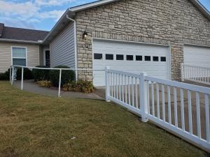 Located in the 55+ community of Cimarron Village, is this lovely 2 bedroom, 2 bath condo. Home features new roof in August, 2020, re-circulating pump on hot water heater which provides instant hot water, 4 skylights, and a walk-in shower from Lifemark out of Springfield which has a lifetime warranty. The garage provides an abundance of extra cabinets for all your storage needs. The current stove is natural gas, but is also wired for an electric stove. The sun room features Levelor Blinds that remain. The Seller has also had an additional 12'' of insulation added in the attic. Monthly Association dues are $60.00.