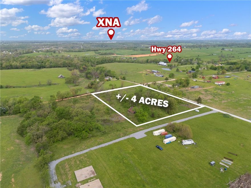 +/- 4 acres of land available just outside city limits, offering the perfect opportunity to build your dream
home, start a hobby farm, or simply enjoy peaceful country living. This prime location is less than 9
minutes from XNA, only 5 minutes from The Creeks Golf Course, and situated just a half mile from
Highway 264, providing convenient access to nearby amenities. Located within the highly sought-after
Bentonville School District, this property combines rural charm with top-tier educational opportunities.
Electric service is available at the street, while a septic system and water well will be needed. The house
currently on the property is set to be removed.