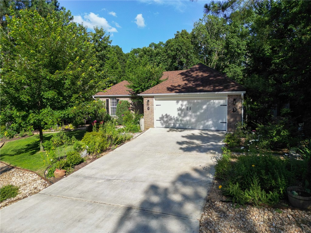 **No showings till OH on Sunday 2pm 6/29/25** Step into this beautifully maintained home, where comfort meets charm both inside and out. The outdoor space is truly special—designed to evoke the feel of a botanical garden, complete with perennial plantings for cut flowers Spring to Fall, a fenced garden bed, a greenhouse, and weed barriers for low-maintenance care. Enjoy butterflies and nature from your spacious, flat fenced yard, which features a stunning split-level Trex deck with railing and a propane connection—perfect for outdoor entertaining. Inside, the kitchen has been tastefully updated with new granite countertops, a tile backsplash, a deep single-basin sink, and a modern stove with an air fryer. Fresh interior paint enhances the inviting atmosphere, while both spacious bathrooms boast quartz countertops, undermount sinks, modern fixtures and custom mirrors. Located just moments from Granton Park, the boat launch, and scenic biking and hiking trails, this immaculate home